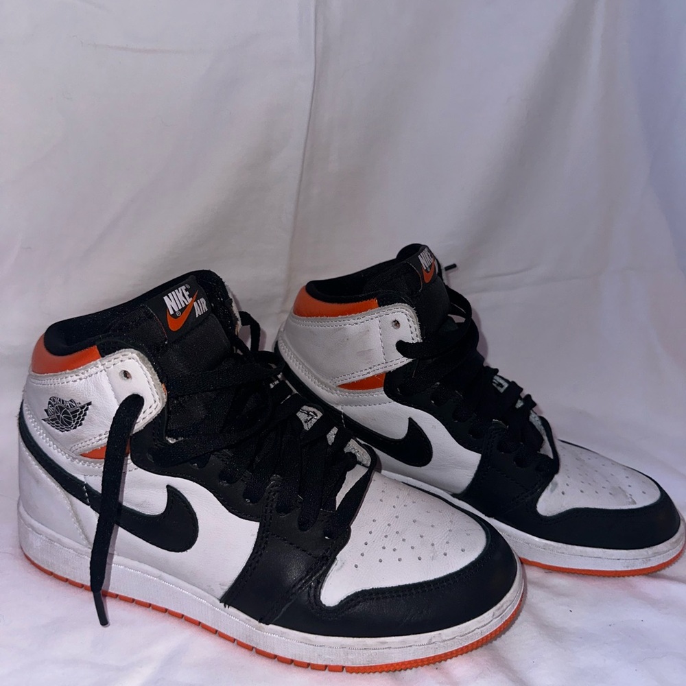 Nike Air Jordan Black and White High-Tops with Orange Accents